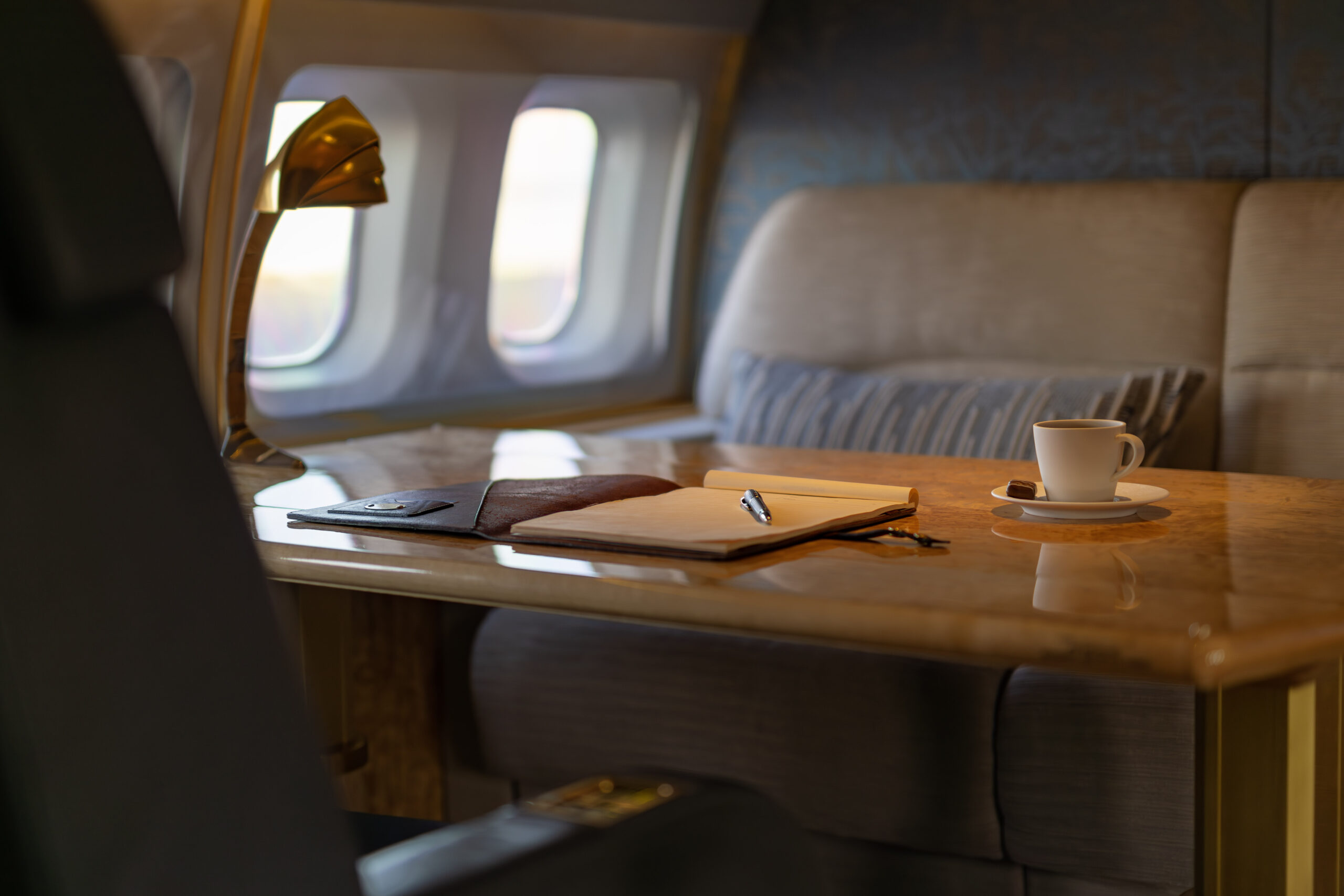 image (1) a luxurious place setting on a table that could be used as a workspace or dining table in a private jet